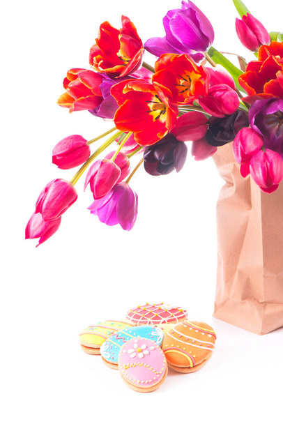 Beautiful bouquet of purple tulips in paper bag, isolated on white - Φωτογραφία, εικόνα