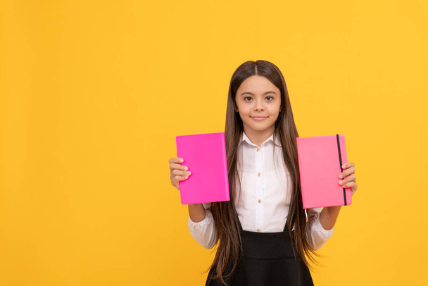 smiling teen girl hold books. nerd with planner notepad. back to school. education. book store. childrens literature. intellectual child reader. educational literature. bookish kid in grammar school. - Φωτογραφία, εικόνα