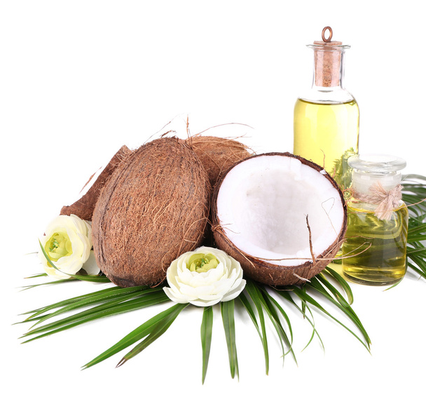 Coconuts and coconut oil, isolated on white - Φωτογραφία, εικόνα