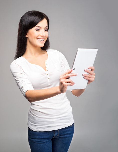 Girl holding an ipad tablet pc - Фото, изображение
