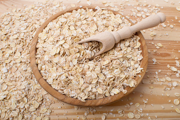 rustic oatmeal. Tasty oatmeal on wooden table - Photo, Image