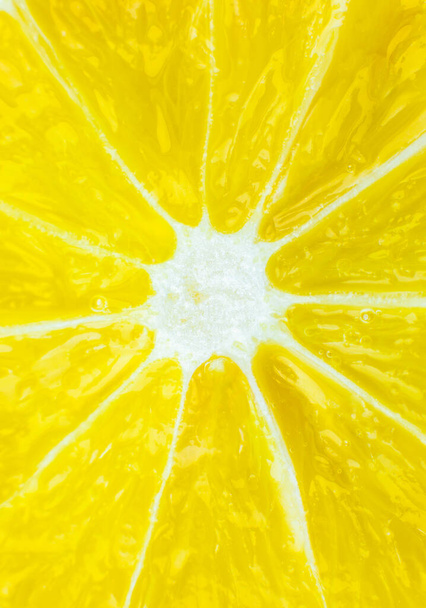 Close up photo of lemon texture background. Fruit cut in half, inside, macro view. - Foto, imagen