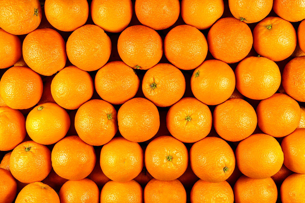 Background of many pieces of oranges, overhead view, studio food photography. Macro - Photo, Image