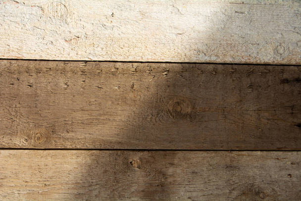 Wood texture background different shades of brown with light and shadow pattern - Fotografie, Obrázek