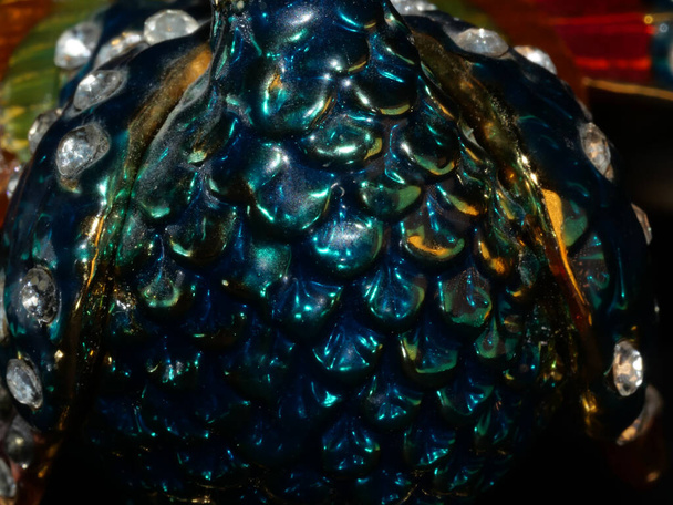 figurine of a peacock and jeweler bracelet of the bride. Vintage metal bird figurines. - Photo, Image