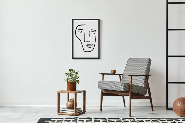 Stylish scandinavian composition of living room with design armchair, black mock up poster frame, plant, wooden stool, book, decoration, loft wall and personal accessories in modern home decor. - Fotó, kép