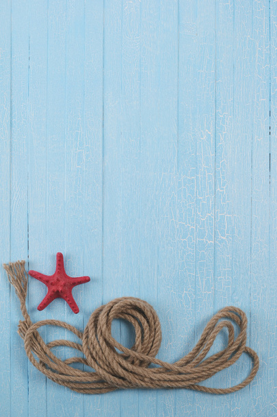 rope  starfish on blue  background - Фото, изображение