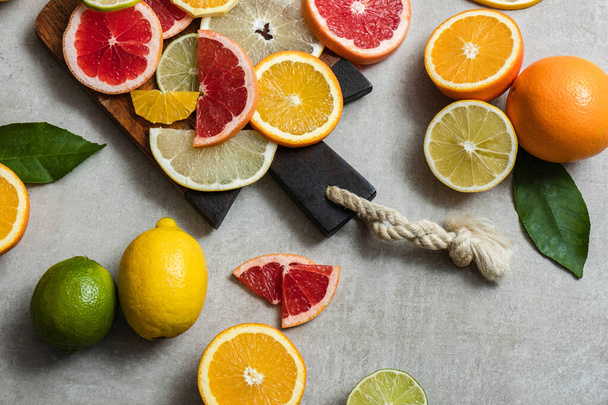 https://cdn.create.vista.com/api/media/small/464698136/stock-photo-slices-fresh-fruit-cutting-board-colorful-citrus-fruit-slices-wooden