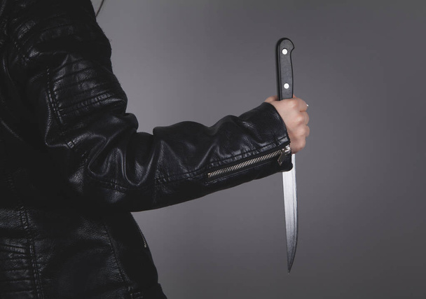 Caucasian killer knife in hand. Crime concept. - Foto, immagini