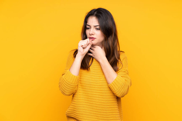 Young caucasian woman isolated on yellow background is suffering with cough and feeling bad - Photo, Image