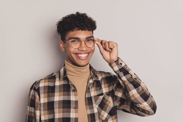 Photo of charming smart afro american young man wear glasses good mood isolated on grey color background - Fotografie, Obrázek