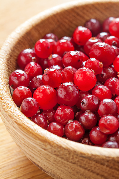 Red cranberries in wooden dish - Photo, Image