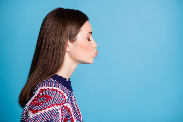 Profile side view portrait of attractive dreamy girl copy space sending air kiss isolated over vibrant blue color background - Φωτογραφία, εικόνα