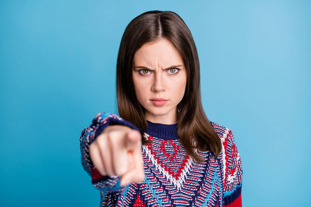 Photo of young angry girl indicate finger you accuse blame trouble isolated over blue color background - Foto, Bild