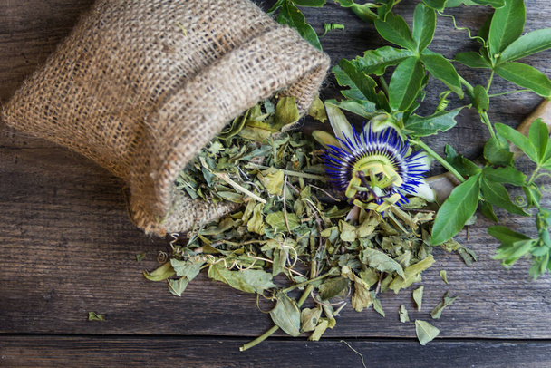 dried flowers and leaves of passiflora or passion fruit to drink sedative tea as an alternative medicine - Fotó, kép