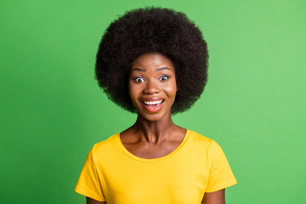 Photo of amazed excited attractive happy dark skin woman smile sale isolated on green color background - 写真・画像
