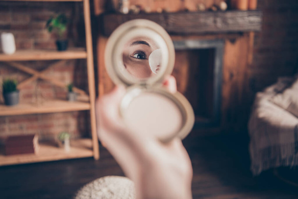 Photo of beautiful attractive young lady eye applying makeup cotton pad looking mirror indoors house room - Φωτογραφία, εικόνα