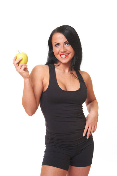 Fitness girl with green apple isolated on white - Foto, imagen