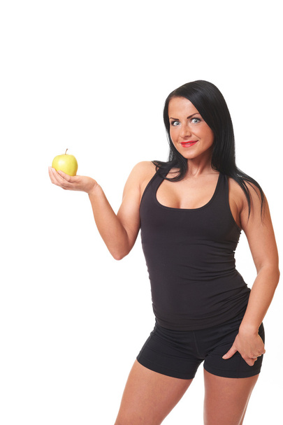 Fitness girl with green apple isolated on white - Foto, Imagen