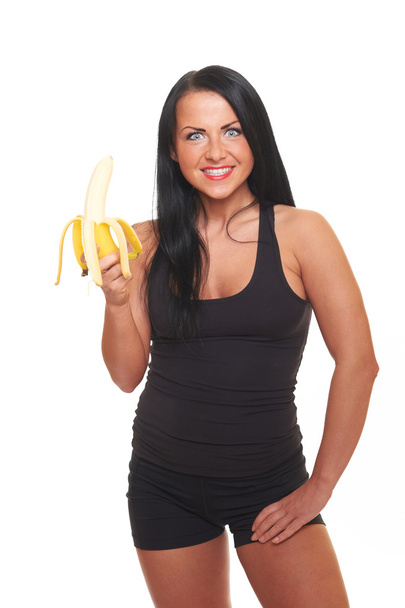 Fitness girl with banana isolated on white - Foto, Imagen