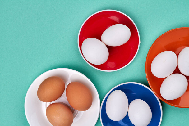 Top view small plates of boiled eggs. - Zdjęcie, obraz