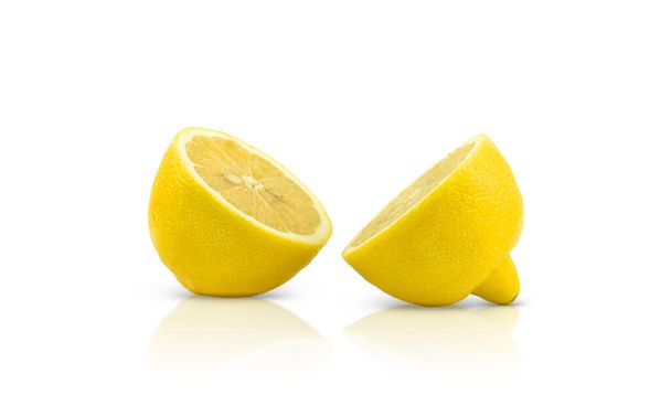 One sliced lemon is isolated on a white background - Photo, Image