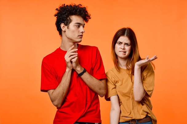 boy and girl colorful t-shirt grimace communication - Foto, Imagen