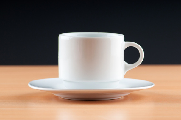 White cup against colourful gradient on the table - Photo, Image