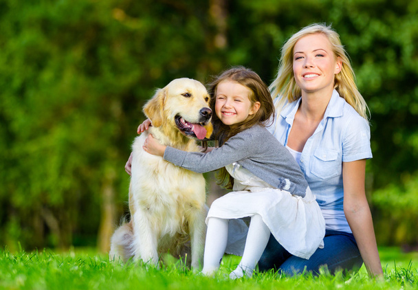 Mother and daughter with pet - Foto, Bild