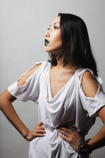 Beautiful young asian female model with black lips and long hair, wearing white bluse - Φωτογραφία, εικόνα