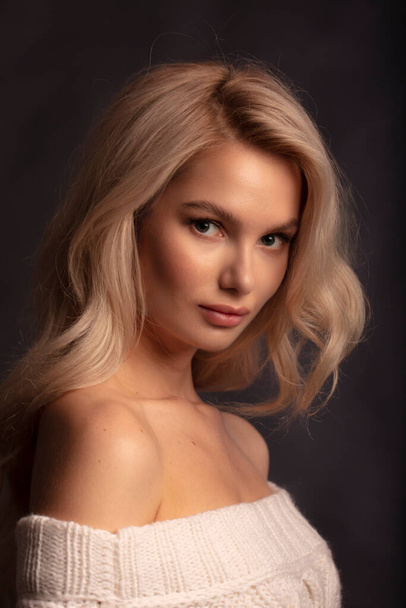 Blonde hair female model posing on camera  - Фото, зображення