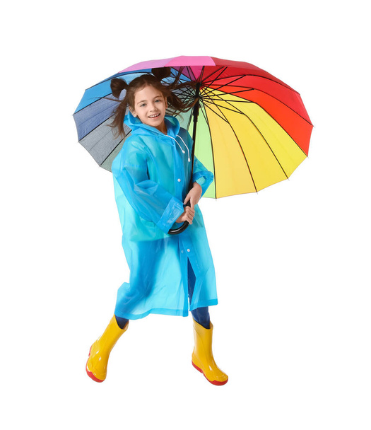 Jumping little girl with umbrella on white background - Foto, Imagem