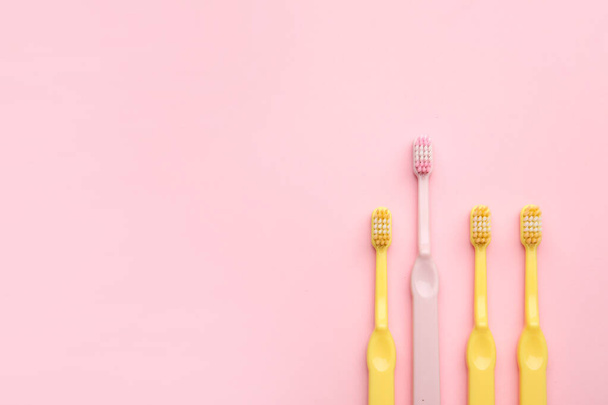 Tooth brushes on color background - Foto, Imagem