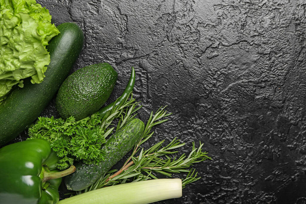 Healthy green vegetables on dark background - Photo, image