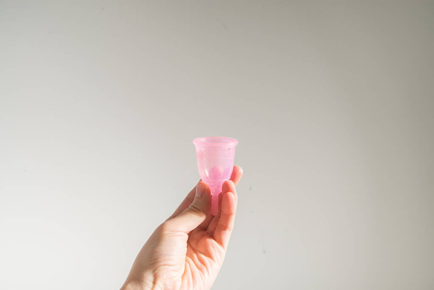 concept of using reusable menstrual cup during woman periods - Zdjęcie, obraz