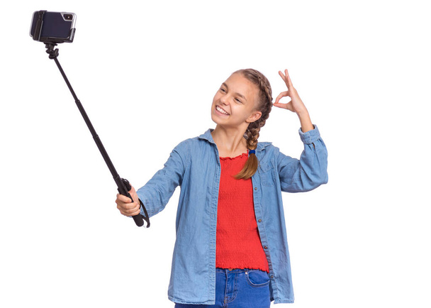 Teen girl with selfie stick - Fotoğraf, Görsel