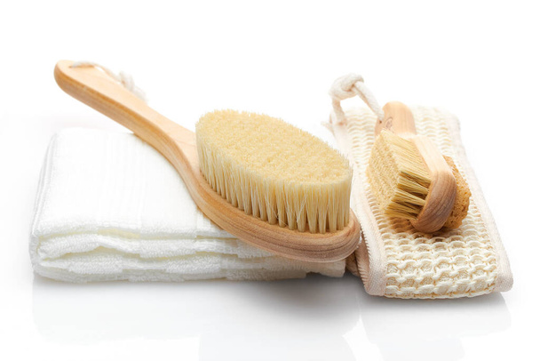 A set of items from natural materials for body care isolated on a white background. Dry massage brush, washcloth, pumice stone. Self-care concept - Photo, Image
