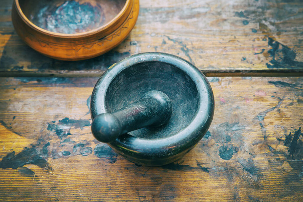 mortar & pestle black marble on table background for grinding ingredients - Фото, изображение