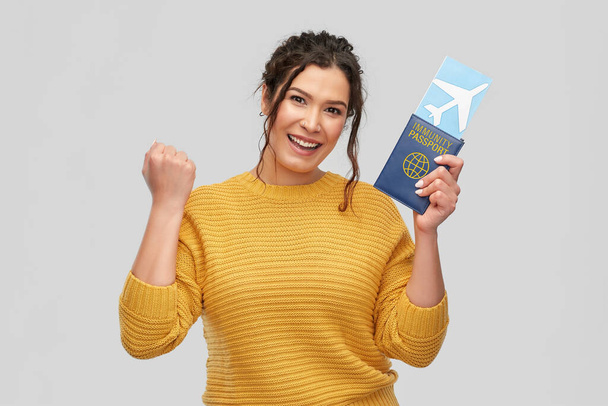 happy woman with air ticket and immunity passport - Foto, Imagem