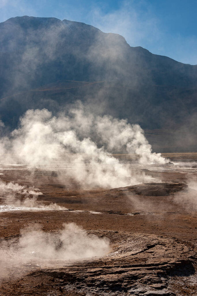 Dawn at the geysers and geothermal steam vents of the El Tatio Geyser Field at 4500m (14764ft) in the Atacama Desert in Northern Chile - Due to the altitude temperatures at dawn can be as low as -15C - Fotoğraf, Görsel