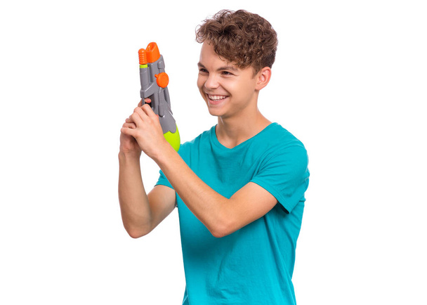 Teen boy with water gun - Photo, Image