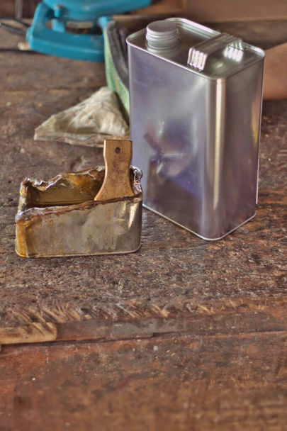 Paint can, paint tray, paint brush, paint bucket, silver square, background on the old wooden table, carpentry room - Zdjęcie, obraz