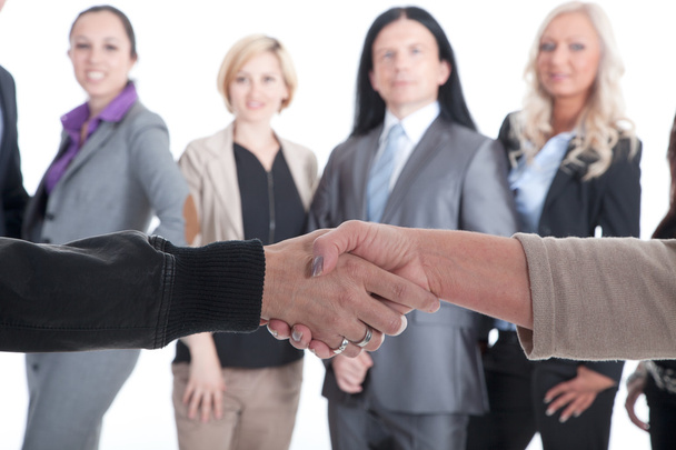 Handshake on the background of business team - Valokuva, kuva