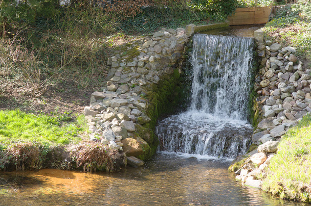 Small waterfall with rocks in Rozendaal in the Netherlands - Photo, Image