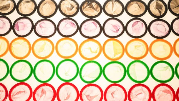 Colorful condoms background. Top view.  - Photo, Image