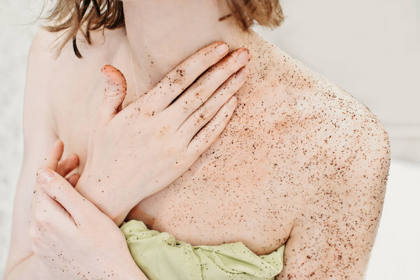 woman applying body exfoliating scrub. natural organic coffee polish on a woman's body  - Photo, image