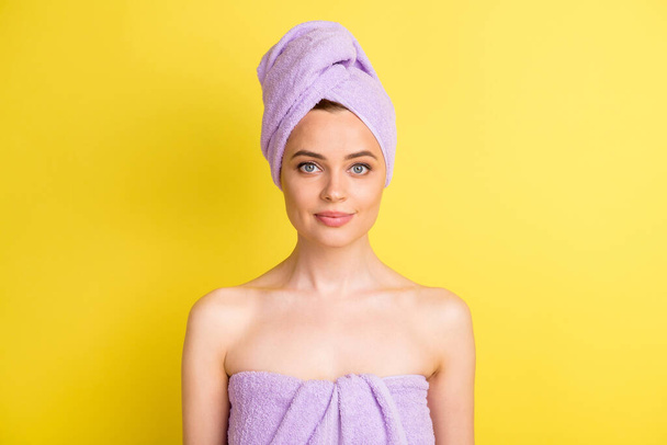 Close-up portrait of attractive nude girl wearing turban washing hair home isolated over bright yellow color background - Фото, зображення