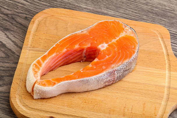 Raw salmon steak over board for cooking - Photo, Image