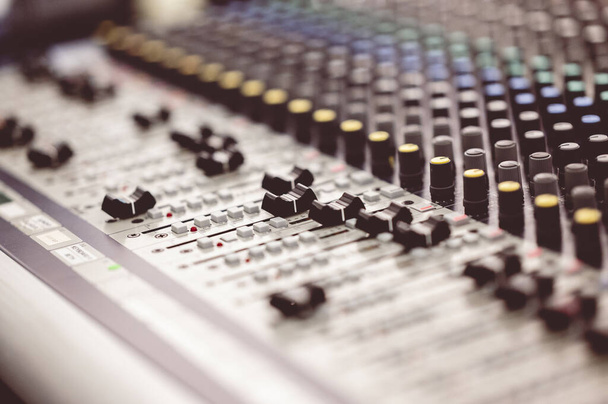 A selective focus shot of a mixing board - 写真・画像