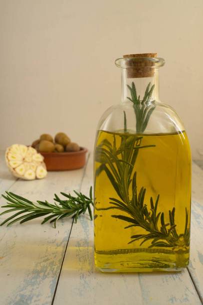 Andalusian olive oil with rosemary and garlic infusion - Photo, Image